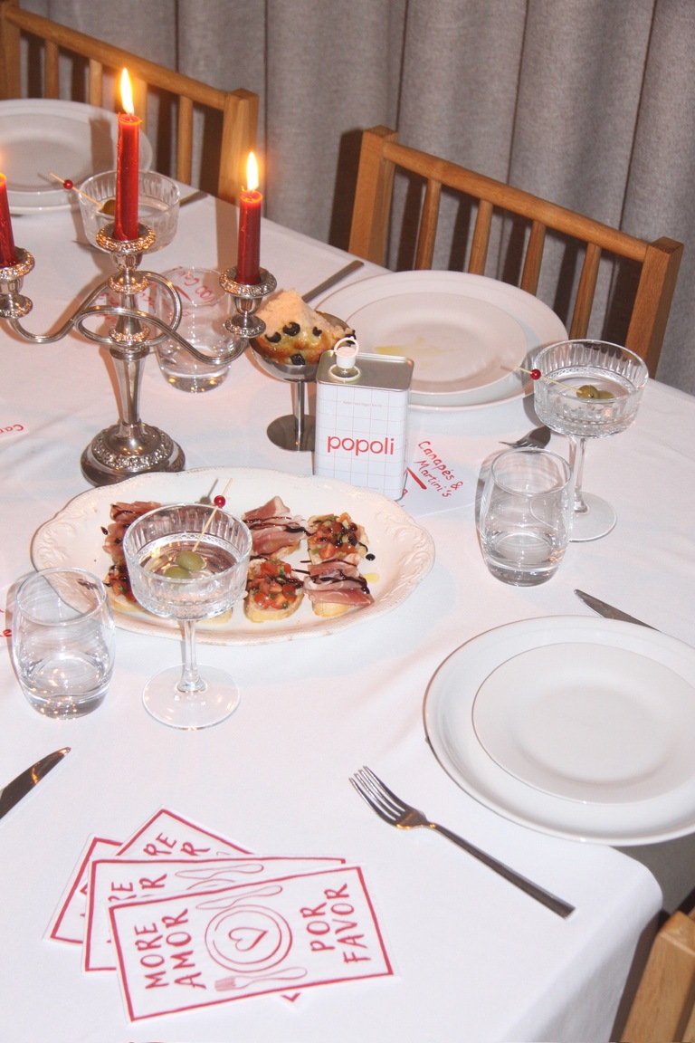 Dinner table laid with popoli olive oil