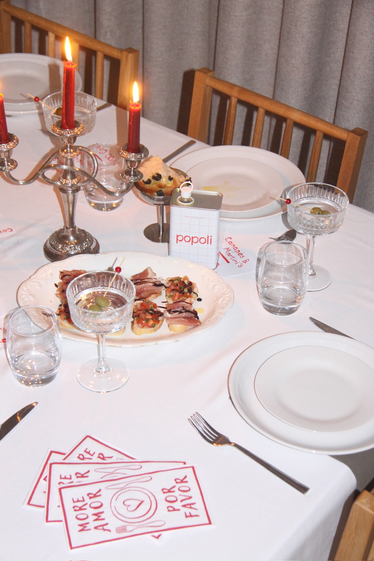 Dinner table laid with popoli olive oil 