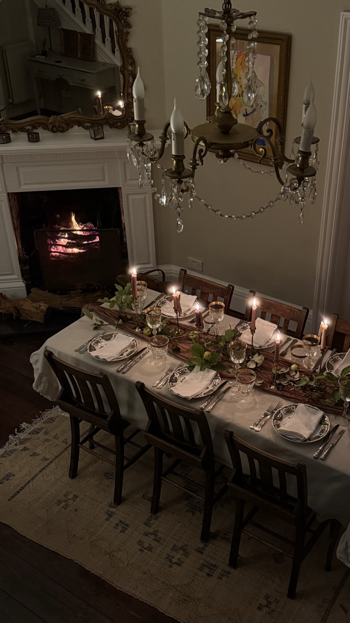 Bird's eye view of decorated table with burning fireplace