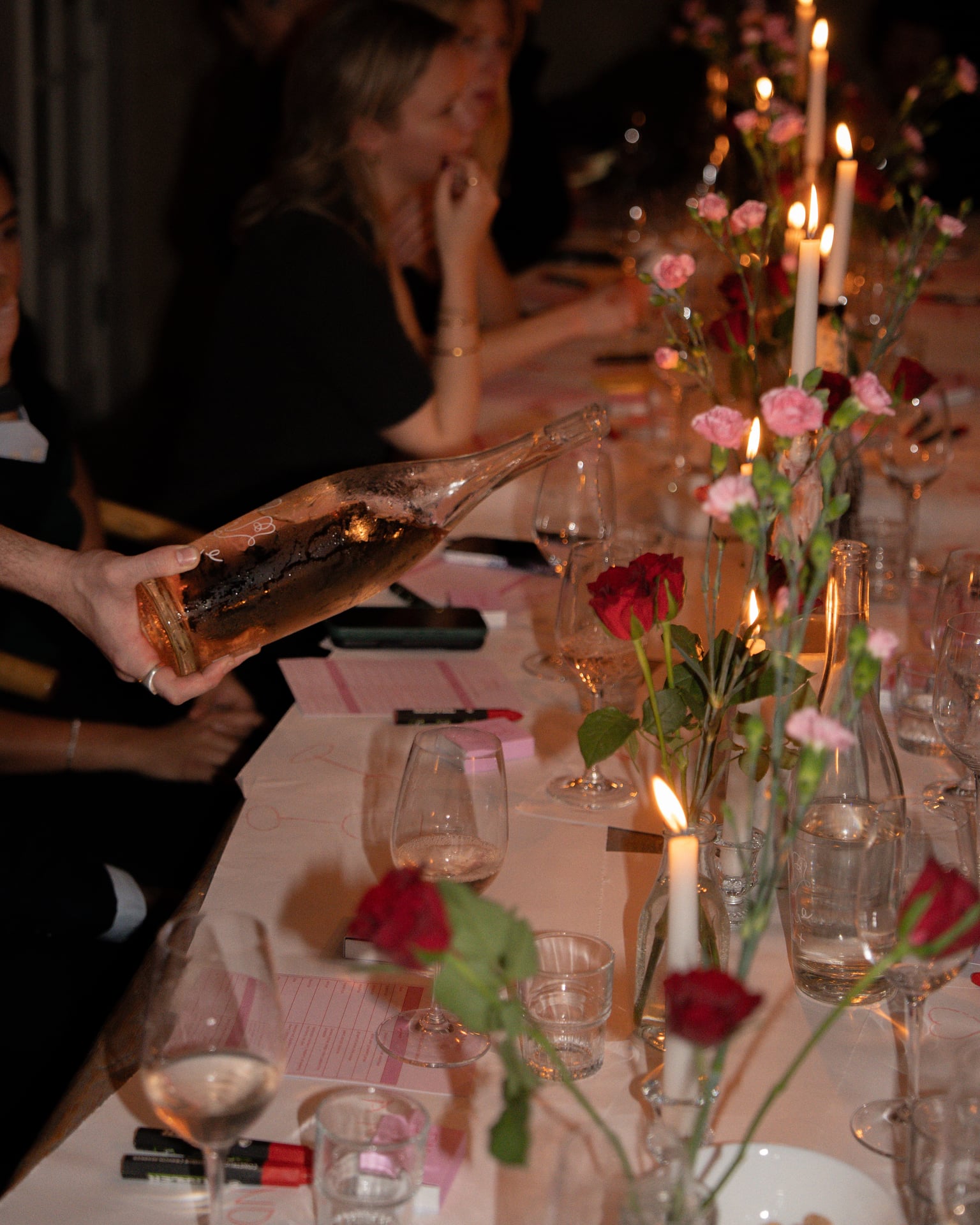 Women enjoying post-Pilates meal with decorated table