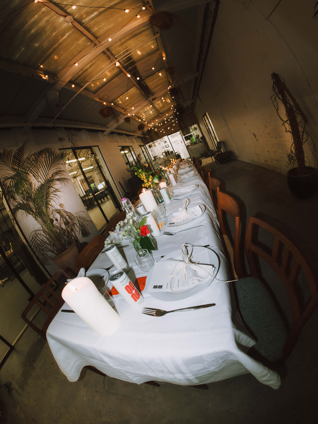 Fish-eye lens shot of guests at oom drinks community supper club